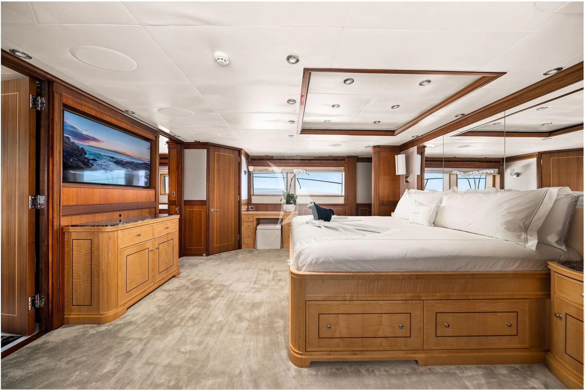 a bedroom with a bed and a tv aboard BLACK SHEEP Yacht for Sale