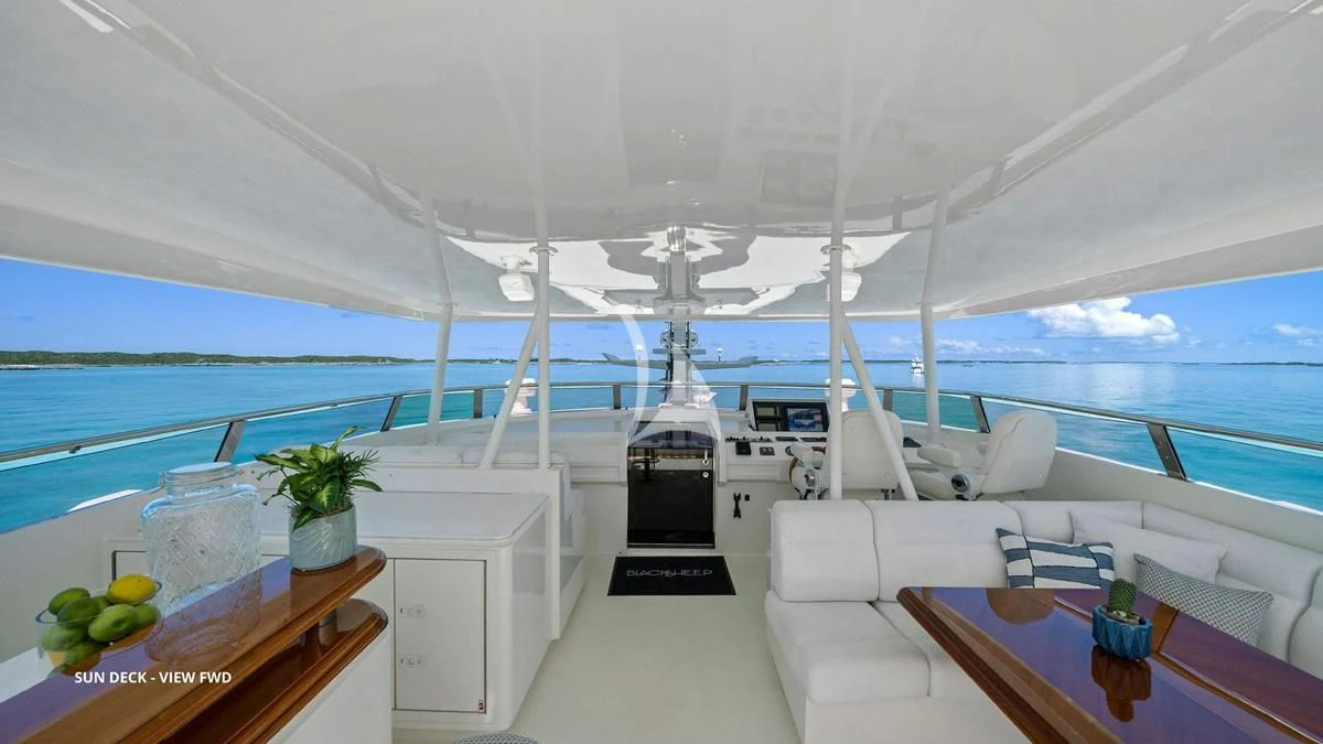 a boat with a table and chairs aboard BLACK SHEEP Yacht for Sale