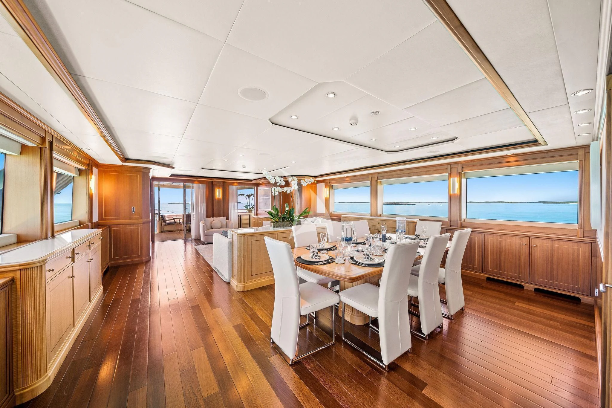 a large dining room with a wood floor aboard BLACK SHEEP Yacht for Sale