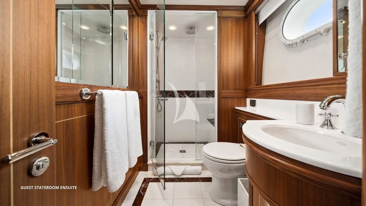 a bathroom with a glass shower aboard BLACK SHEEP Yacht for Sale