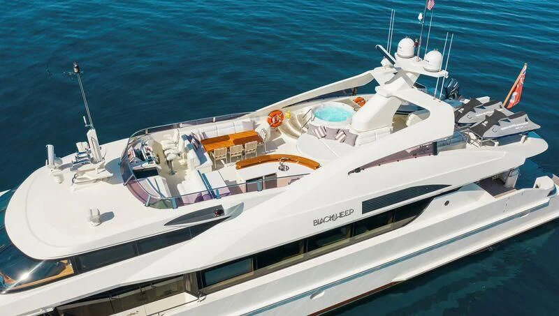 a white yacht on the water aboard BLACK SHEEP Yacht for Sale
