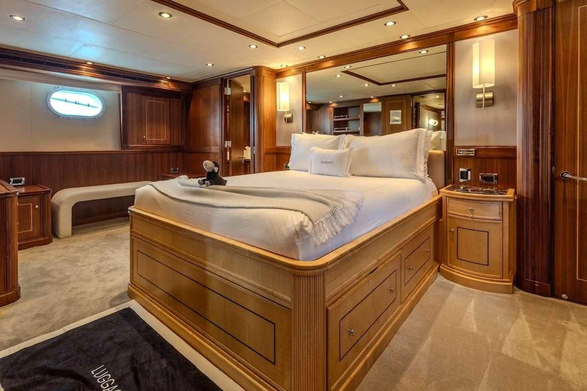 a large bed in a room aboard BLACK SHEEP Yacht for Sale