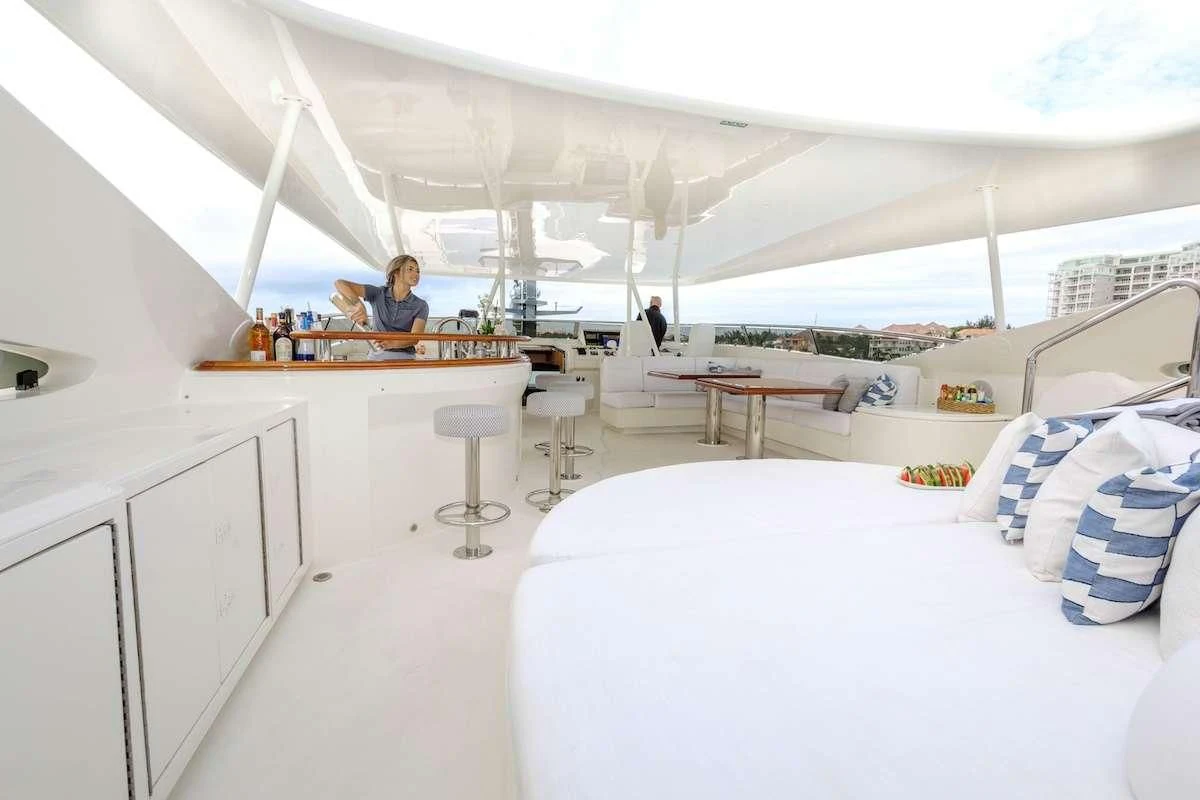 a room with a white bed and white bedding aboard BLACK SHEEP Yacht for Sale