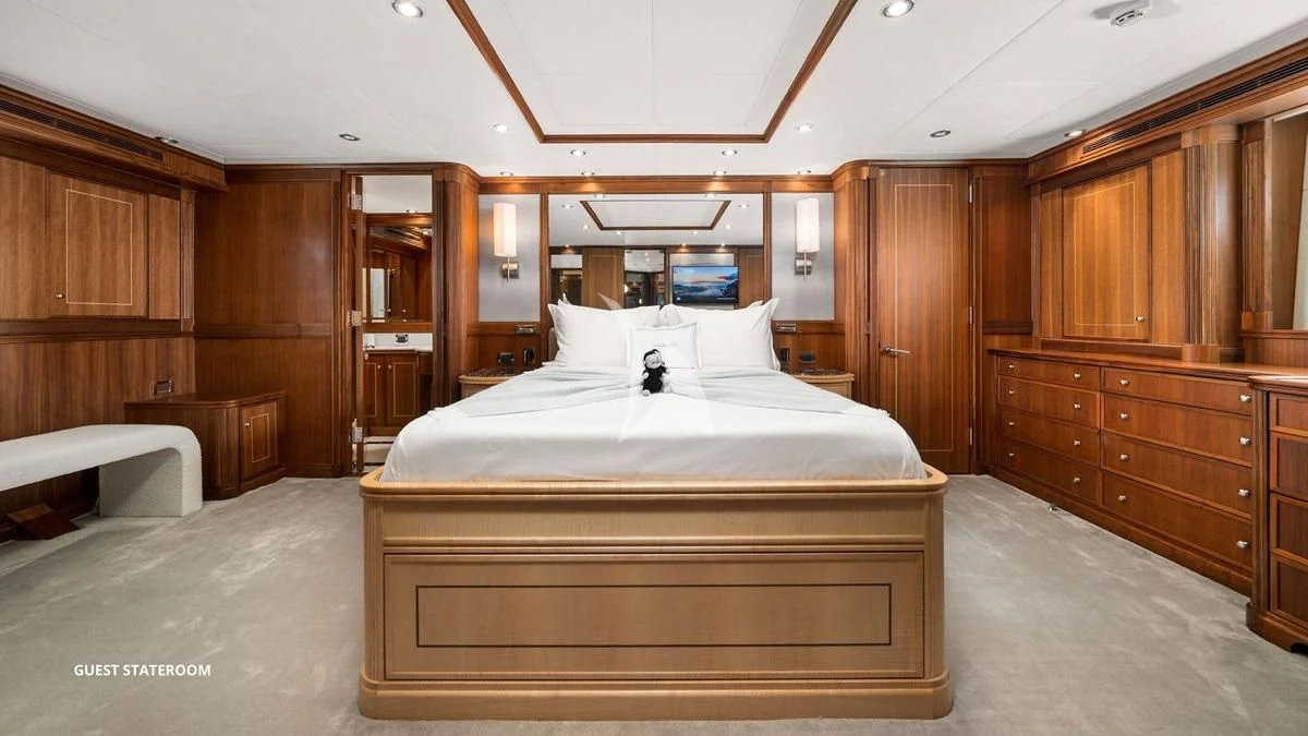 a bed in a wooden room aboard BLACK SHEEP Yacht for Sale