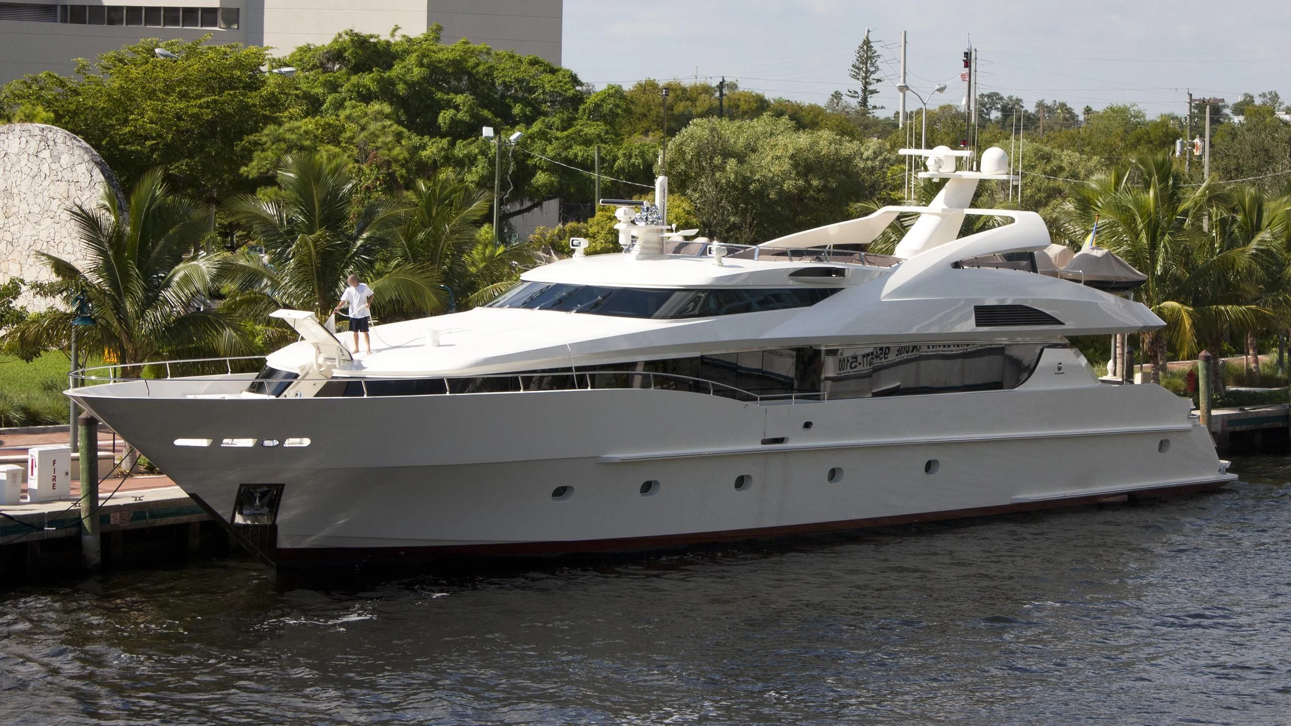 a white yacht in a body of water aboard BLACK SHEEP Yacht for Sale
