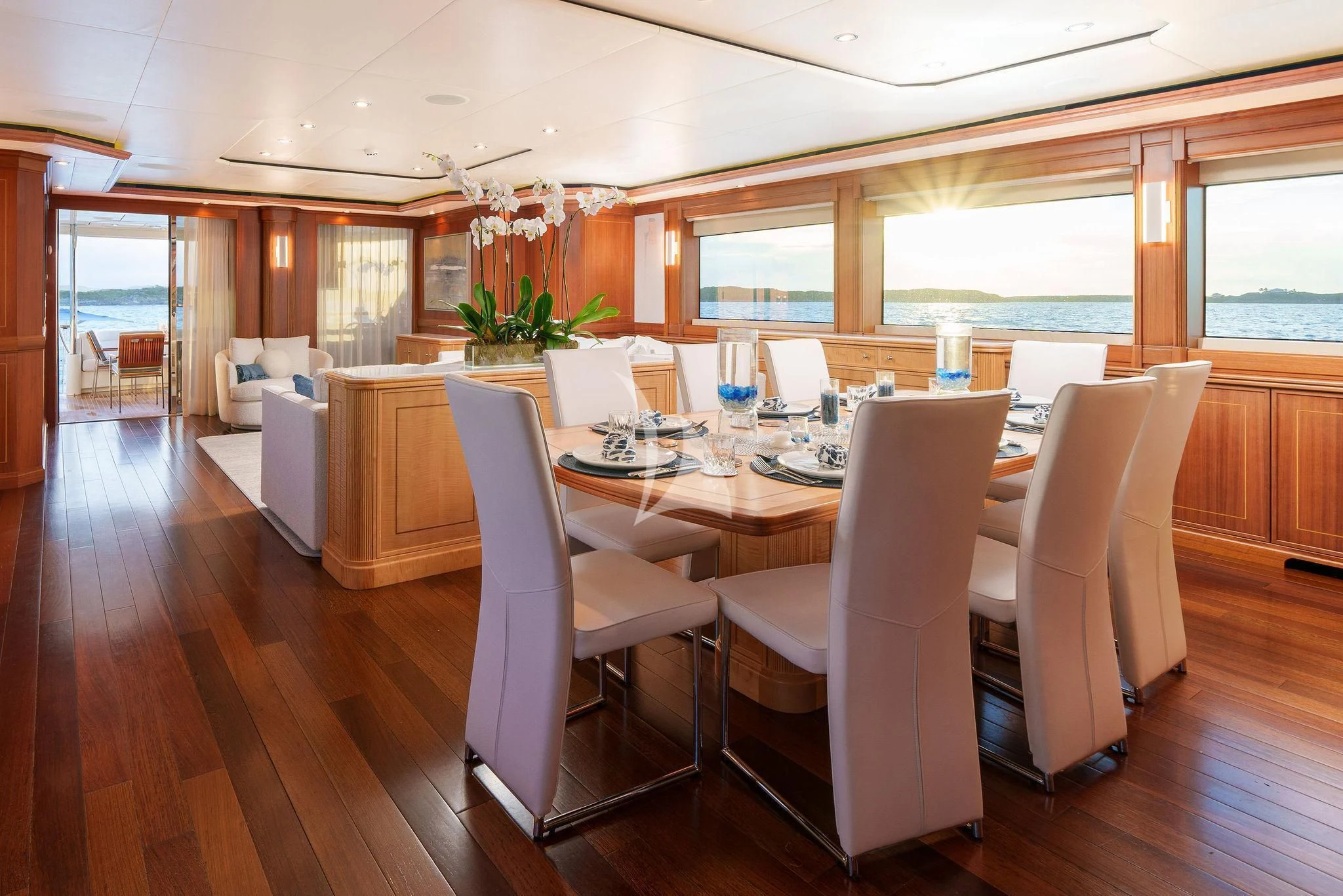 a dining room with white chairs aboard BLACK SHEEP Yacht for Sale