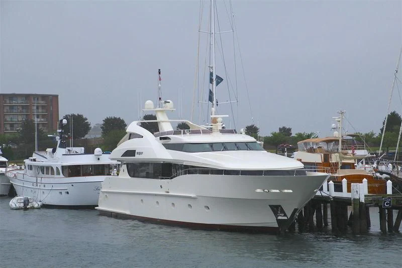 a couple of boats are parked in a harbor aboard BLACK SHEEP Yacht for Sale