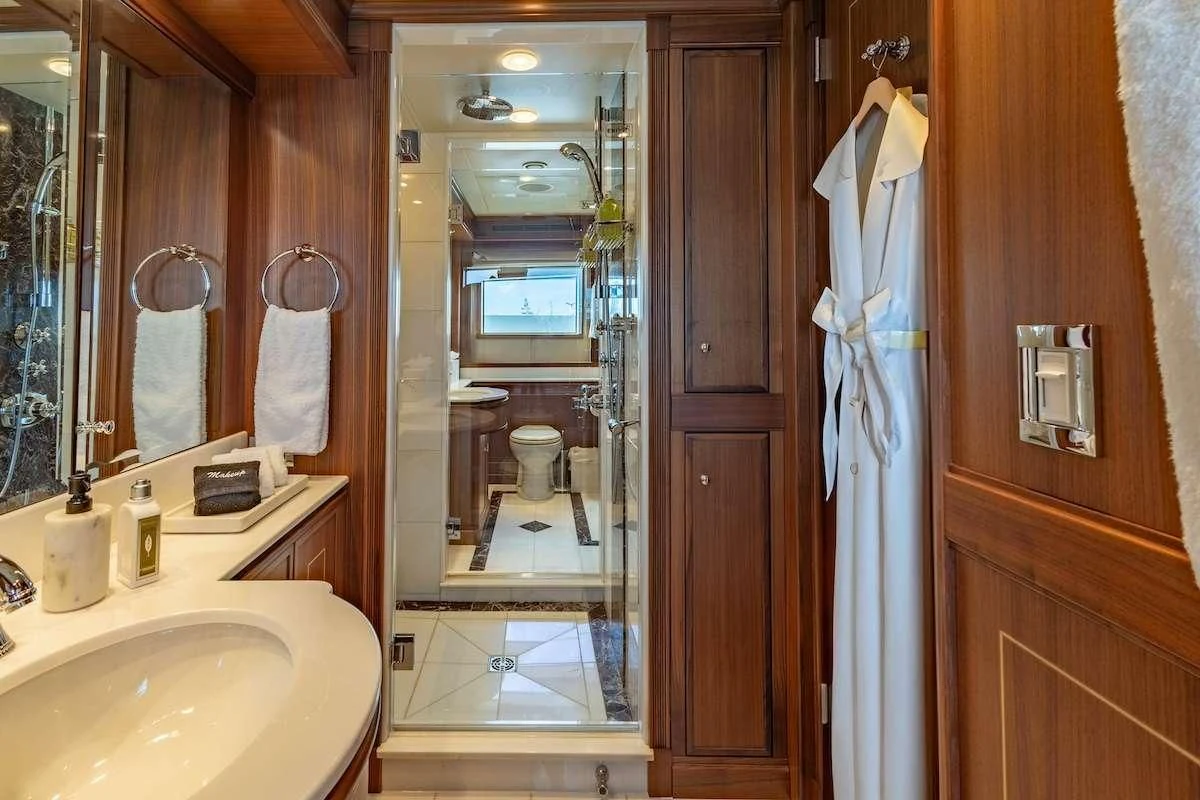 a bathroom with a large mirror aboard BLACK SHEEP Yacht for Sale