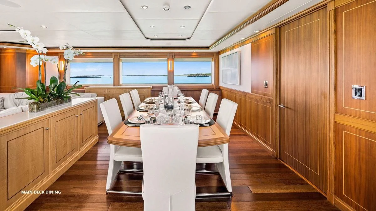 a dining table in a room aboard BLACK SHEEP Yacht for Sale