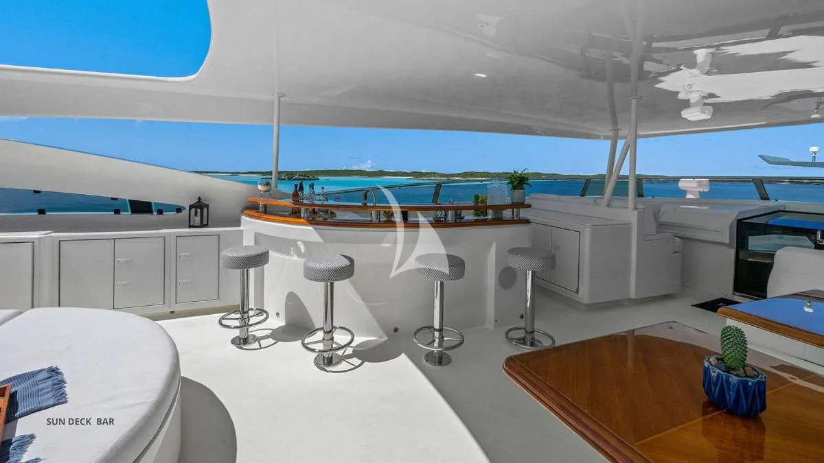 a room with a table and chairs aboard BLACK SHEEP Yacht for Sale