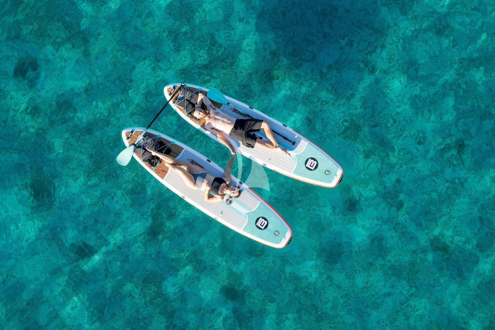 a small white boat in the water aboard BLACK SHEEP Yacht for Sale