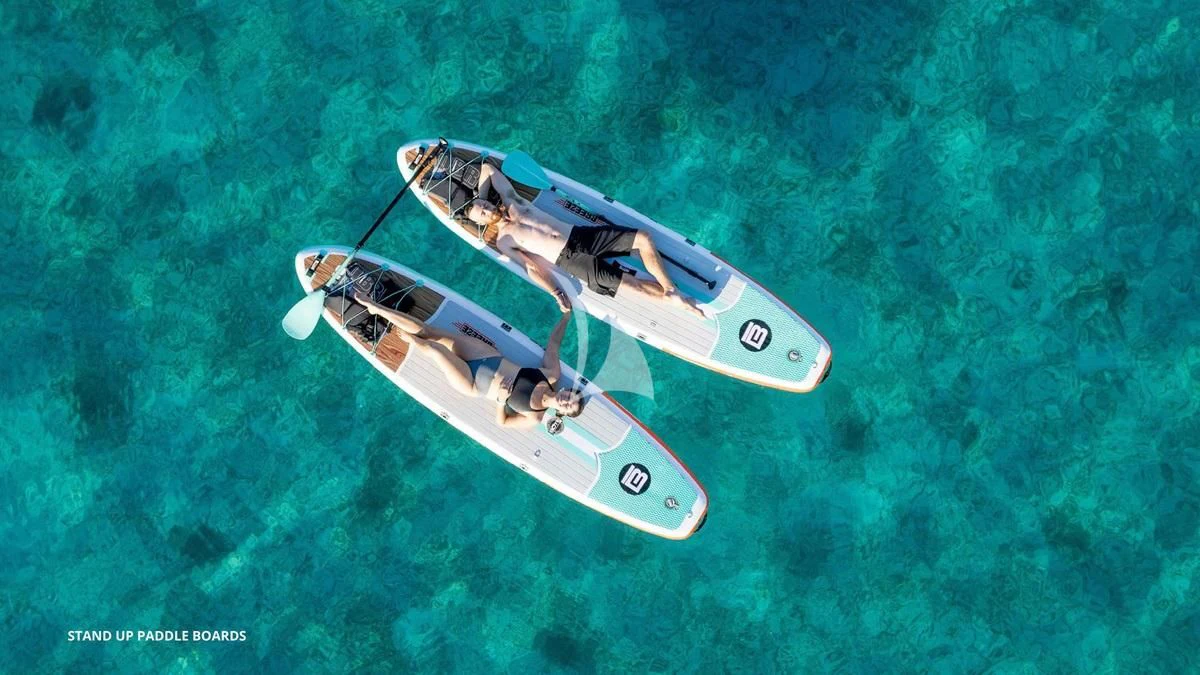 a helicopter flying over a green field aboard BLACK SHEEP Yacht for Sale