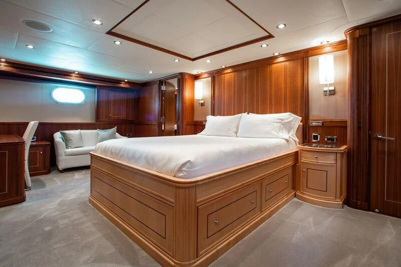 a large bed in a room aboard BLACK SHEEP Yacht for Sale