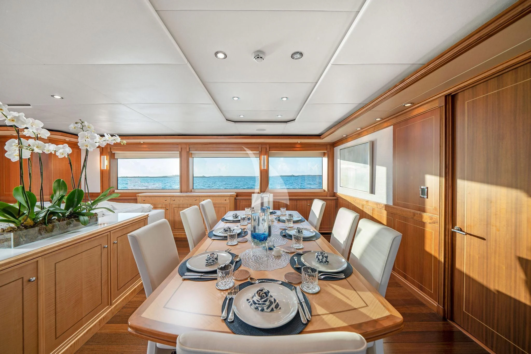 a dining table in a room aboard BLACK SHEEP Yacht for Sale