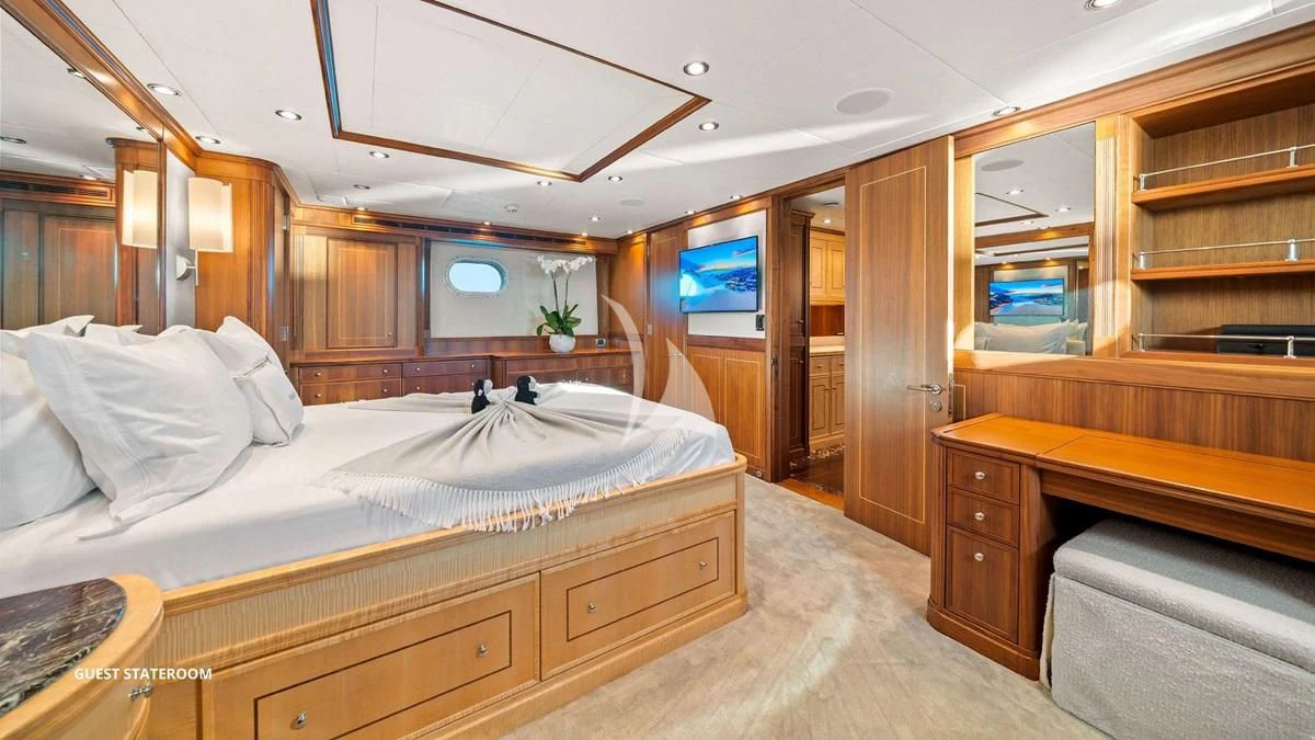 a room with a bed and a tv aboard BLACK SHEEP Yacht for Sale