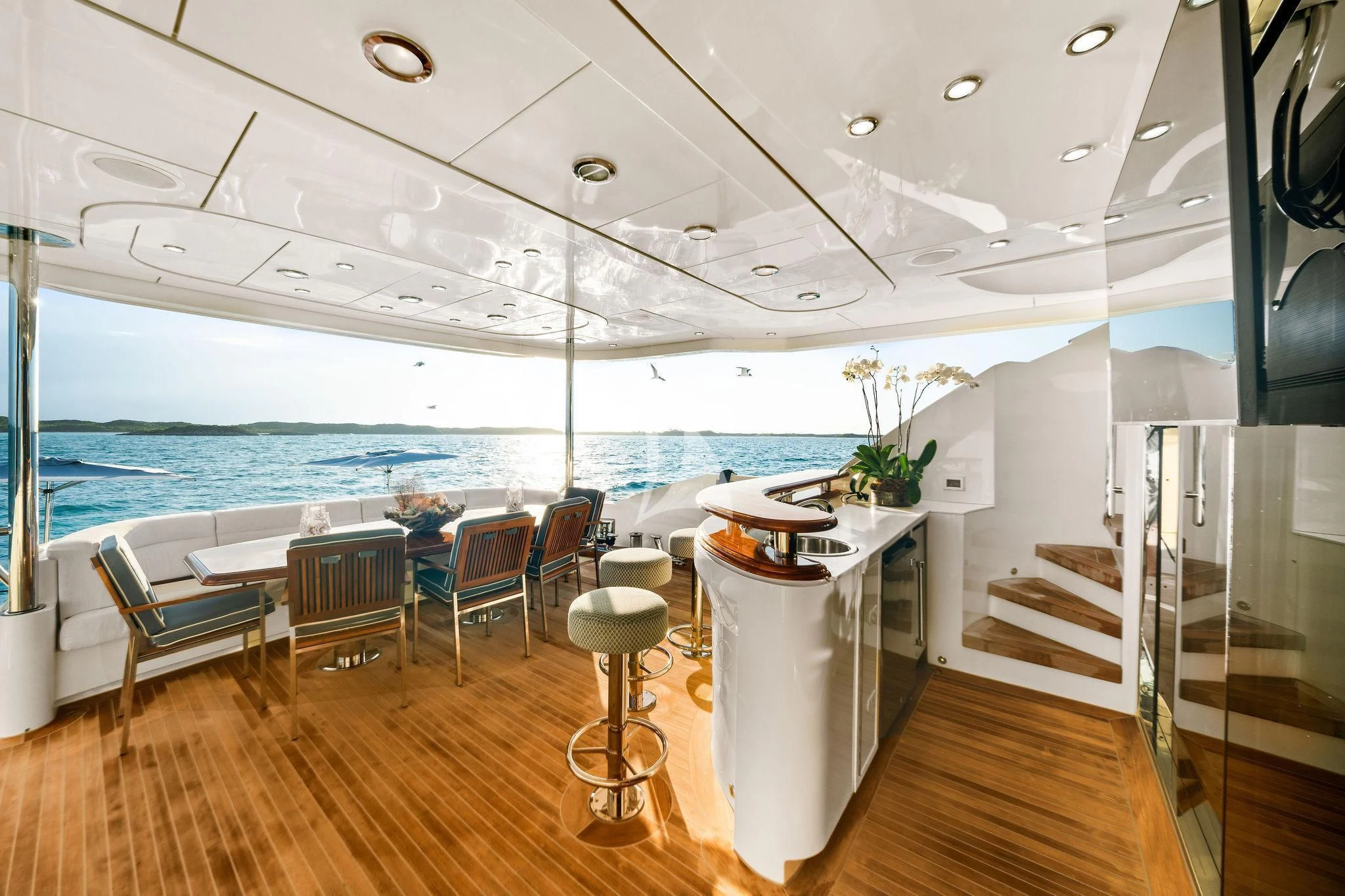 a room with a table chairs and a large window aboard BLACK SHEEP Yacht for Sale