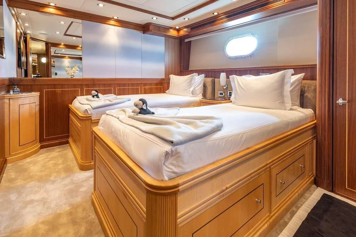 a couple of beds in a hotel room aboard BLACK SHEEP Yacht for Sale
