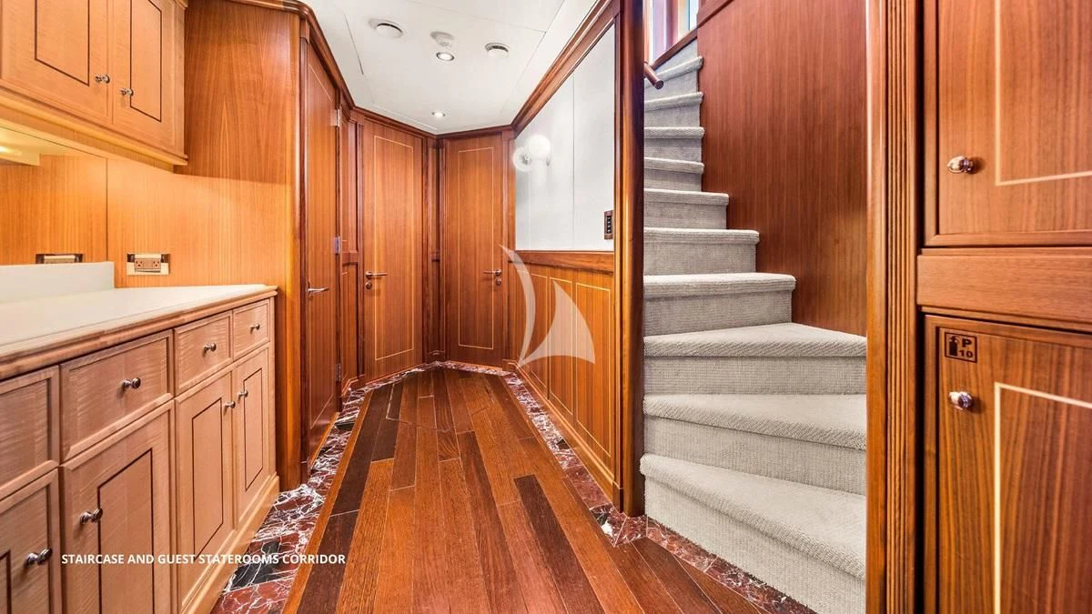 a hallway with wooden cabinets aboard BLACK SHEEP Yacht for Sale