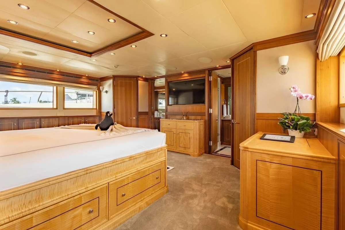 a bedroom with a large bed aboard BLACK SHEEP Yacht for Sale