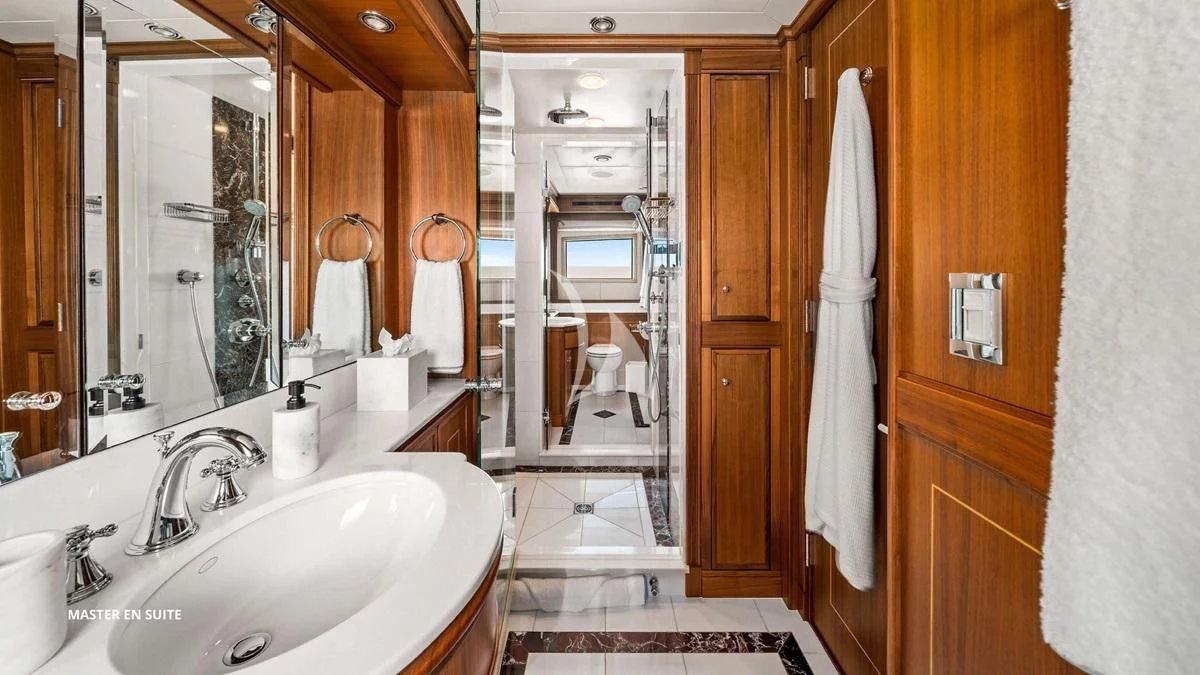 a bathroom with a sink and a mirror aboard BLACK SHEEP Yacht for Sale