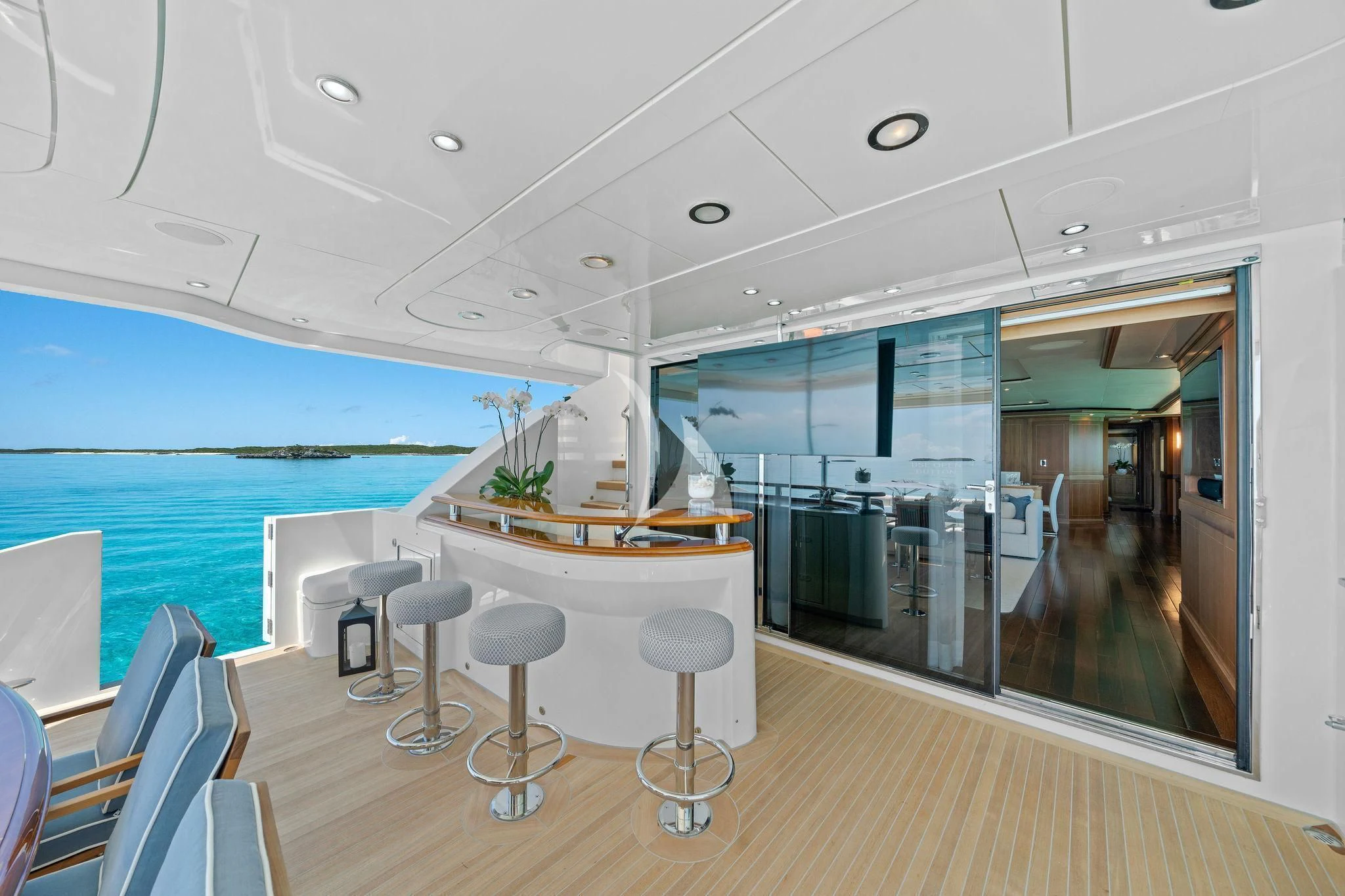a room with a table chairs and a large glass window aboard BLACK SHEEP Yacht for Sale