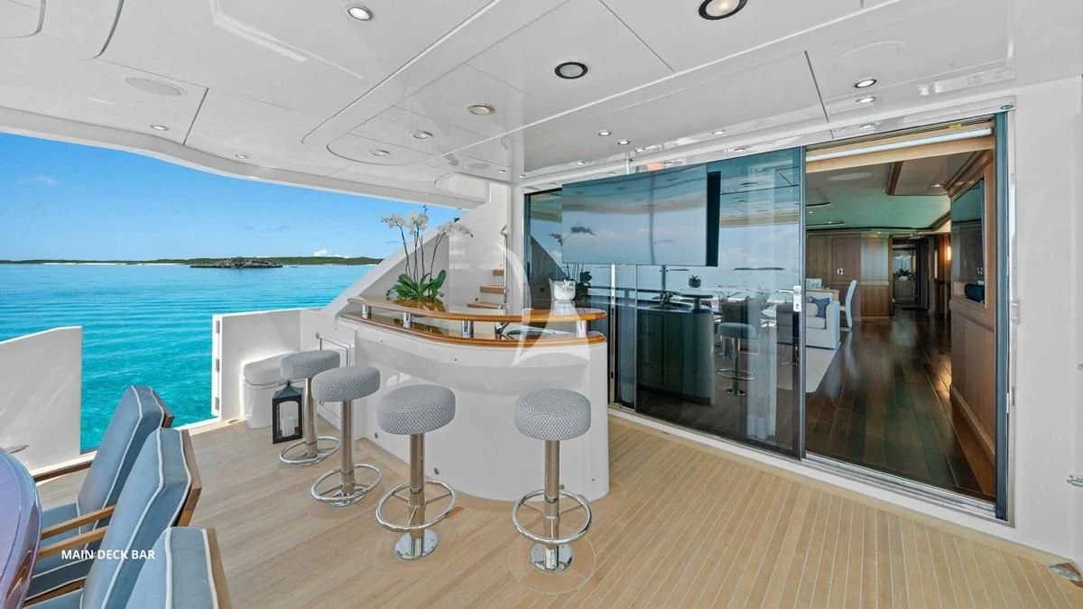 a room with a table chairs and a view of the water aboard BLACK SHEEP Yacht for Sale