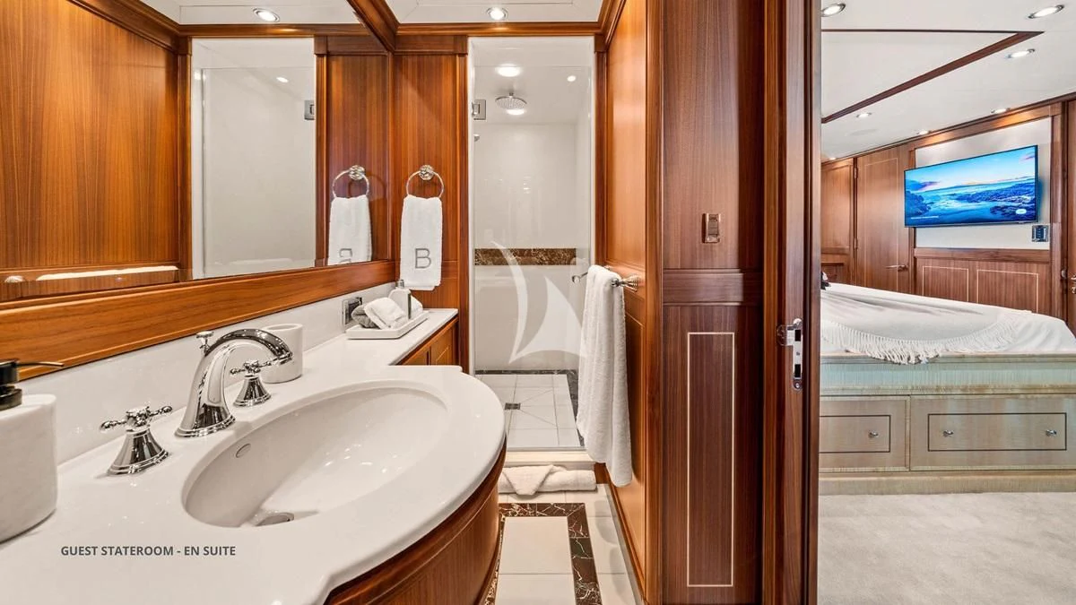 a bathroom with a sink and a mirror aboard BLACK SHEEP Yacht for Sale