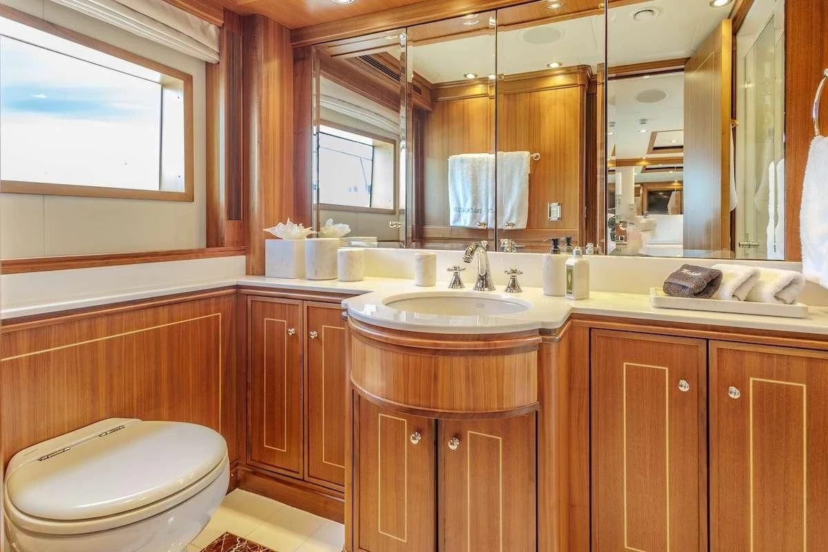 a bathroom with a sink and a toilet aboard BLACK SHEEP Yacht for Sale