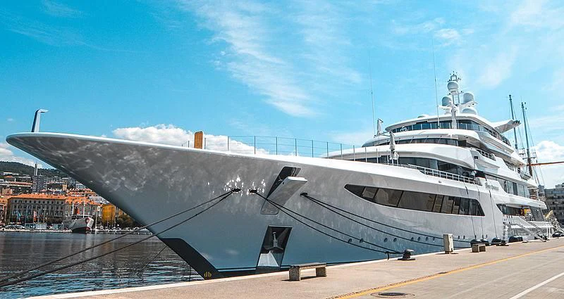 a large ship on a dock aboard ROYAL ROMANCE Yacht for Sale