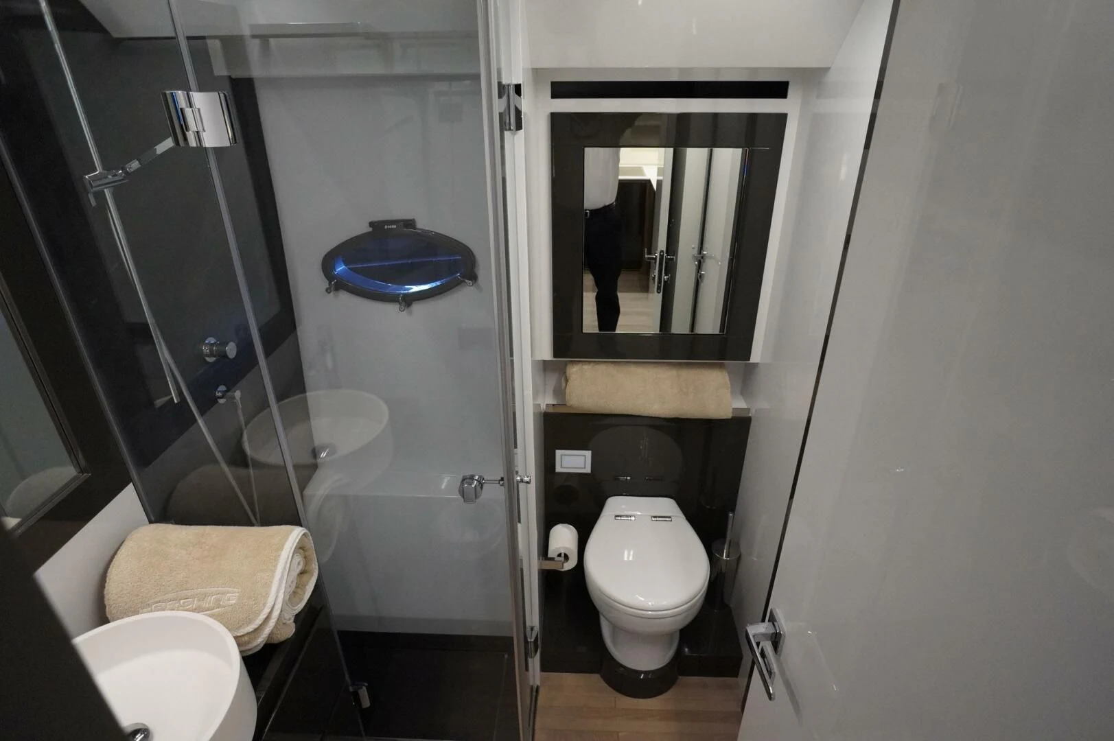 a bathroom with a glass shower aboard THE OFFICE Yacht for Sale