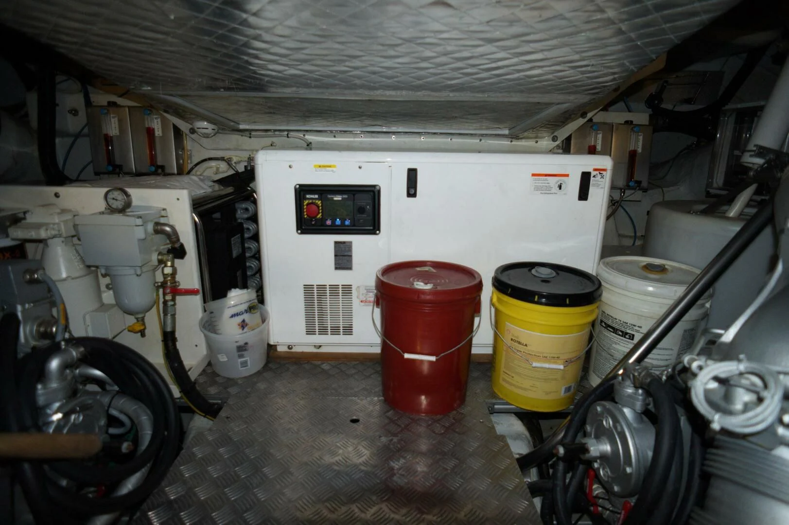 a room with a white machine and a red bucket aboard THE OFFICE Yacht for Sale