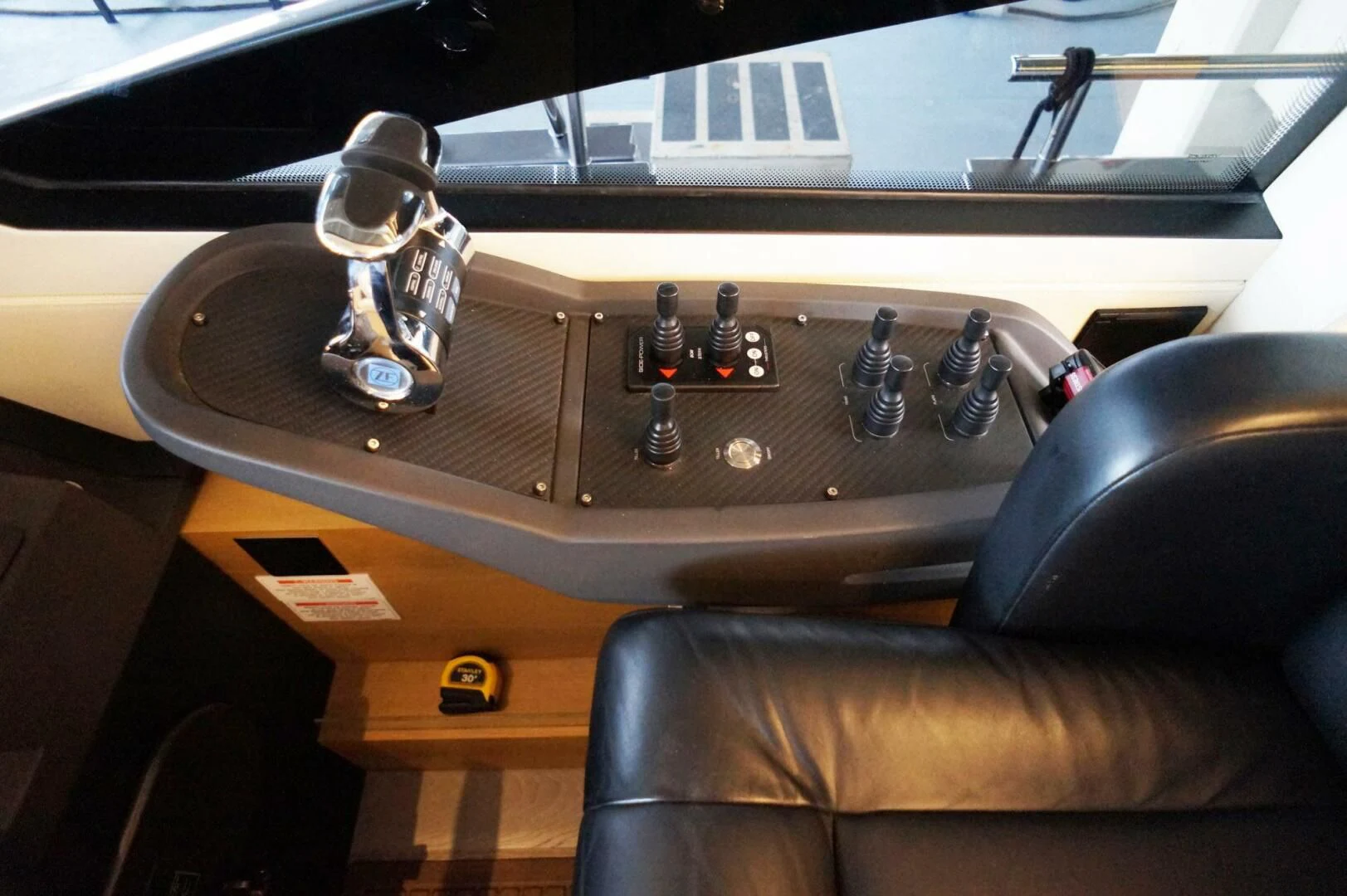 a wooden table with a metal object on it aboard THE OFFICE Yacht for Sale