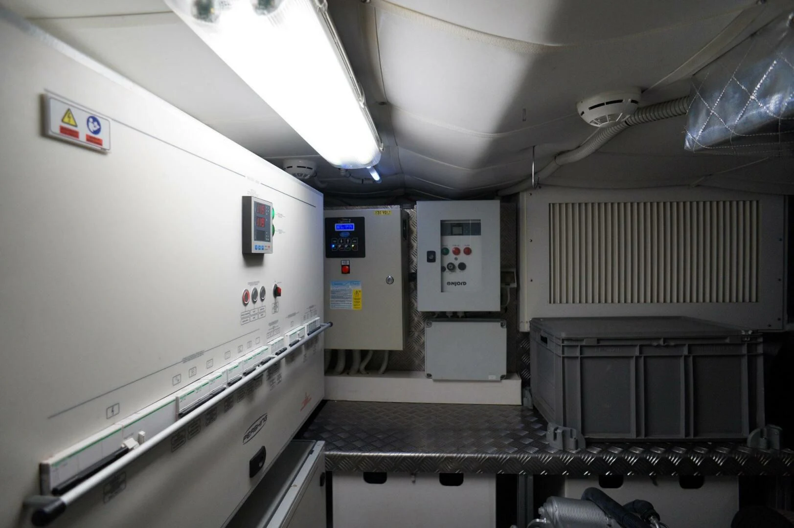 a room with machines and electronic equipment aboard THE OFFICE Yacht for Sale