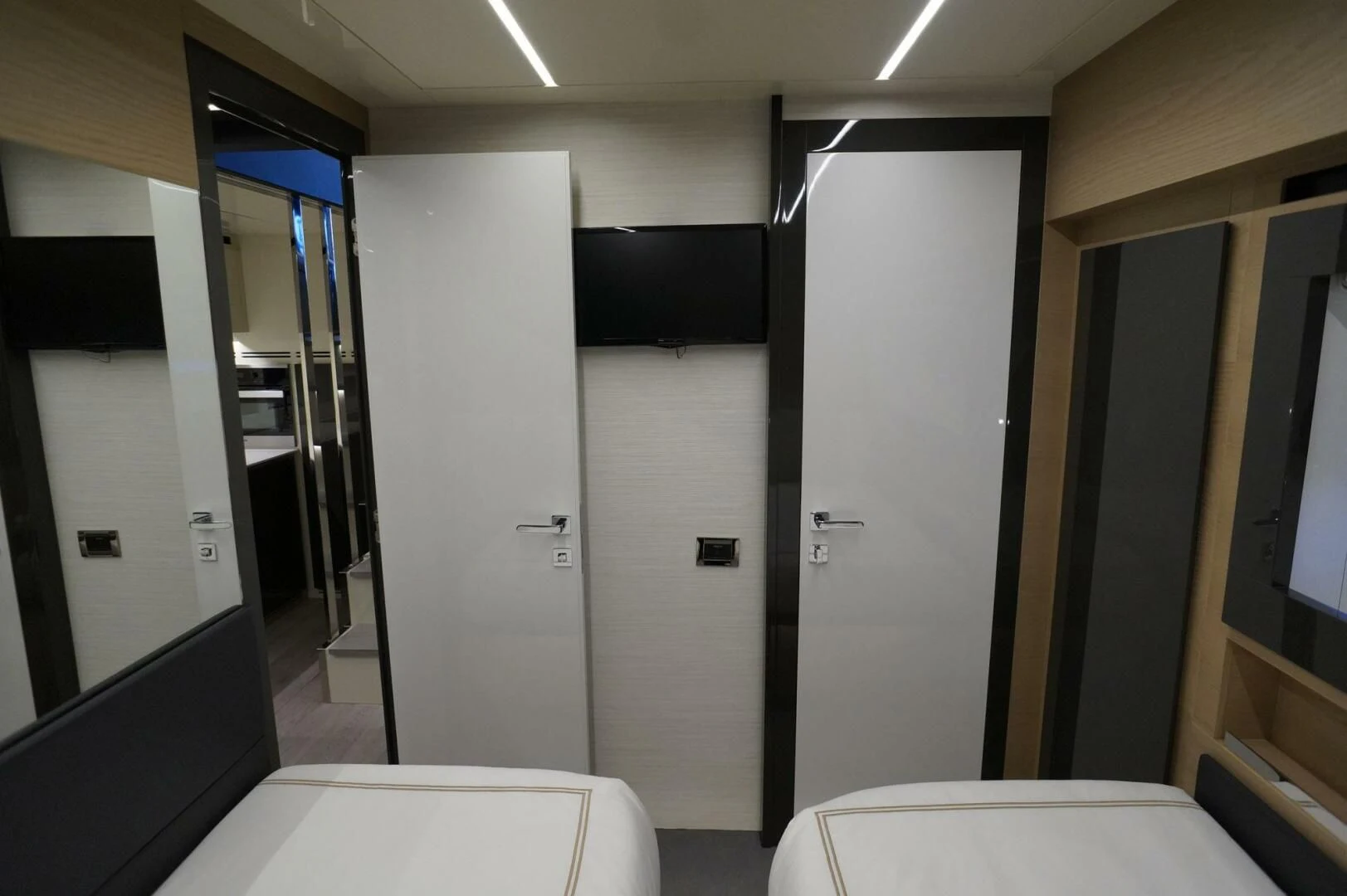 a room with a door and a mirror aboard THE OFFICE Yacht for Sale