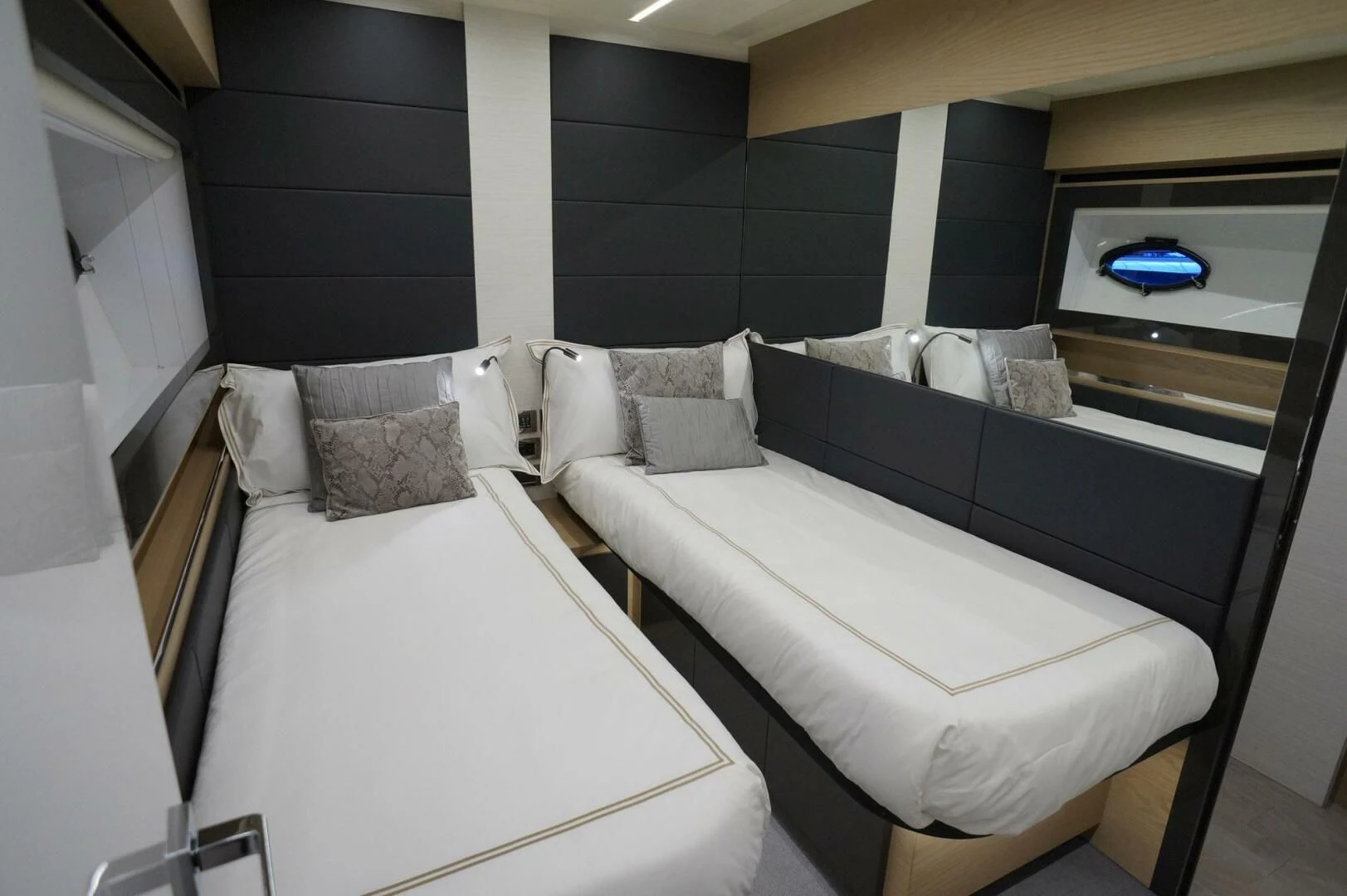 a couple of beds in a room aboard THE OFFICE Yacht for Sale