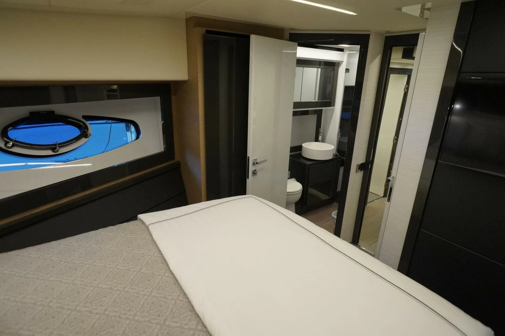 a room with a large white counter and black cabinets aboard THE OFFICE Yacht for Sale