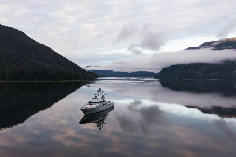 a boat on a lake aboard V6 Yacht for Sale