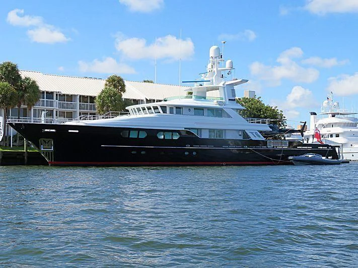 a large cruise ship docked aboard V6 Yacht for Sale