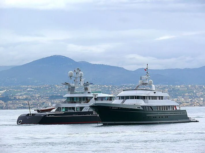 a couple of large boats in the water aboard V6 Yacht for Sale