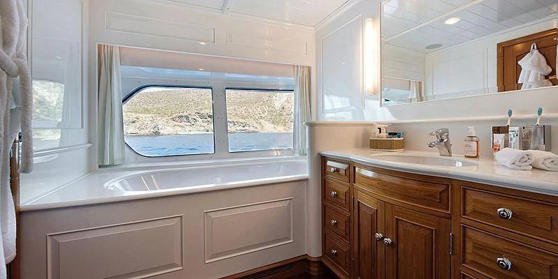 a bathroom with a large window aboard V6 Yacht for Sale