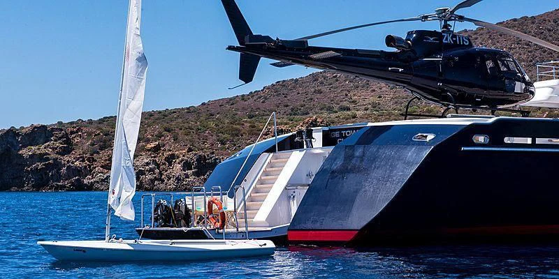 helicopter flying over a boat aboard V6 Yacht for Sale