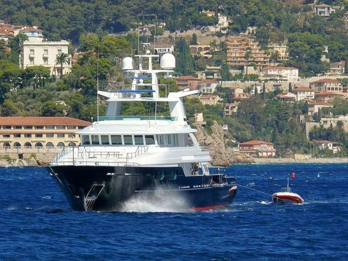 a large white boat in the water aboard V6 Yacht for Sale