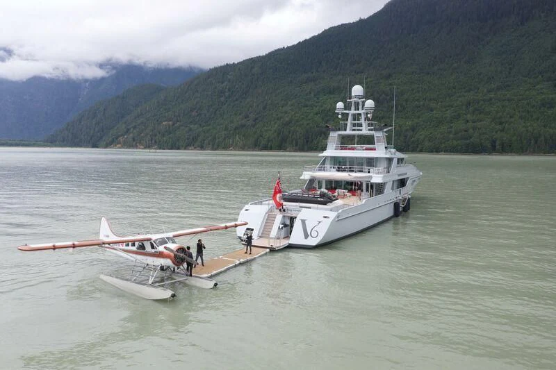 a boat with a motor boat on it aboard V6 Yacht for Sale