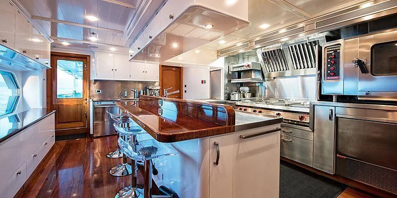 a kitchen with a large island aboard V6 Yacht for Sale