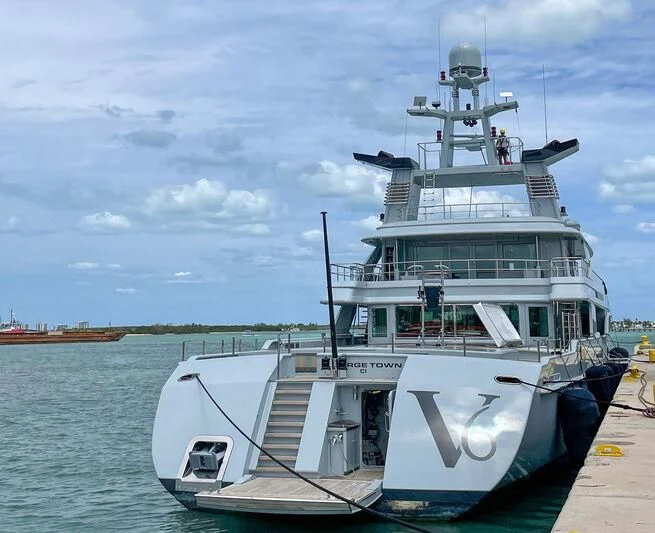 a large white boat on the water aboard V6 Yacht for Sale