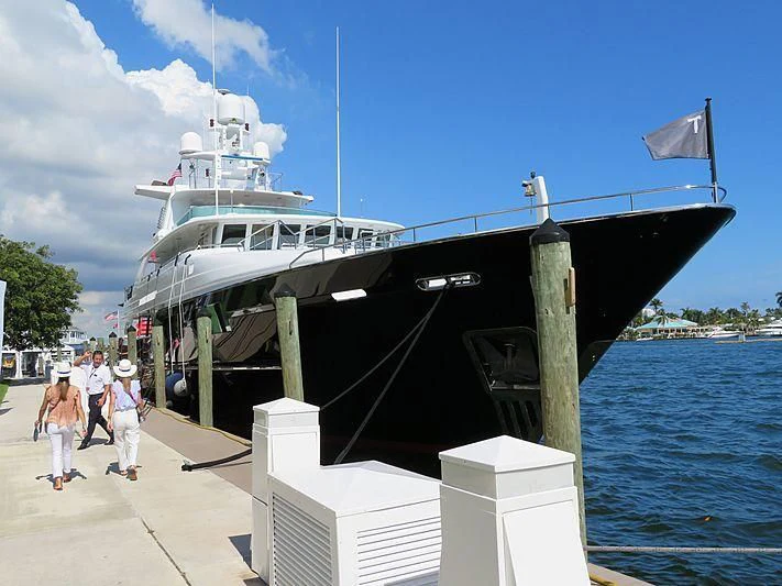 a large boat docked at a pier aboard V6 Yacht for Sale