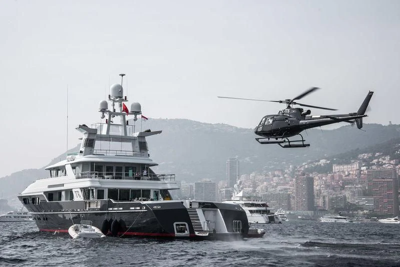 a helicopter flying over a boat aboard V6 Yacht for Sale