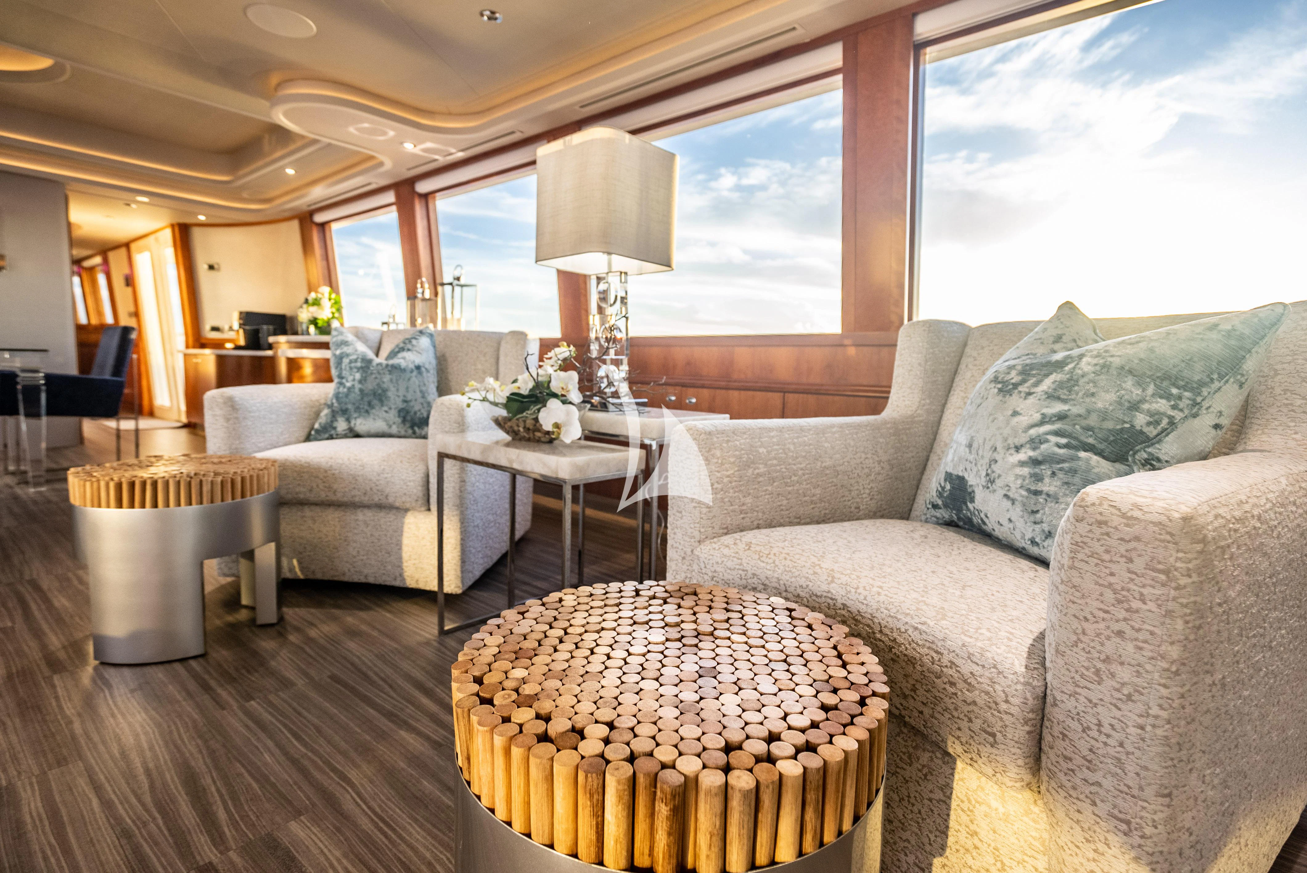 a living room with a large window aboard KEMOSABE Yacht for Charter