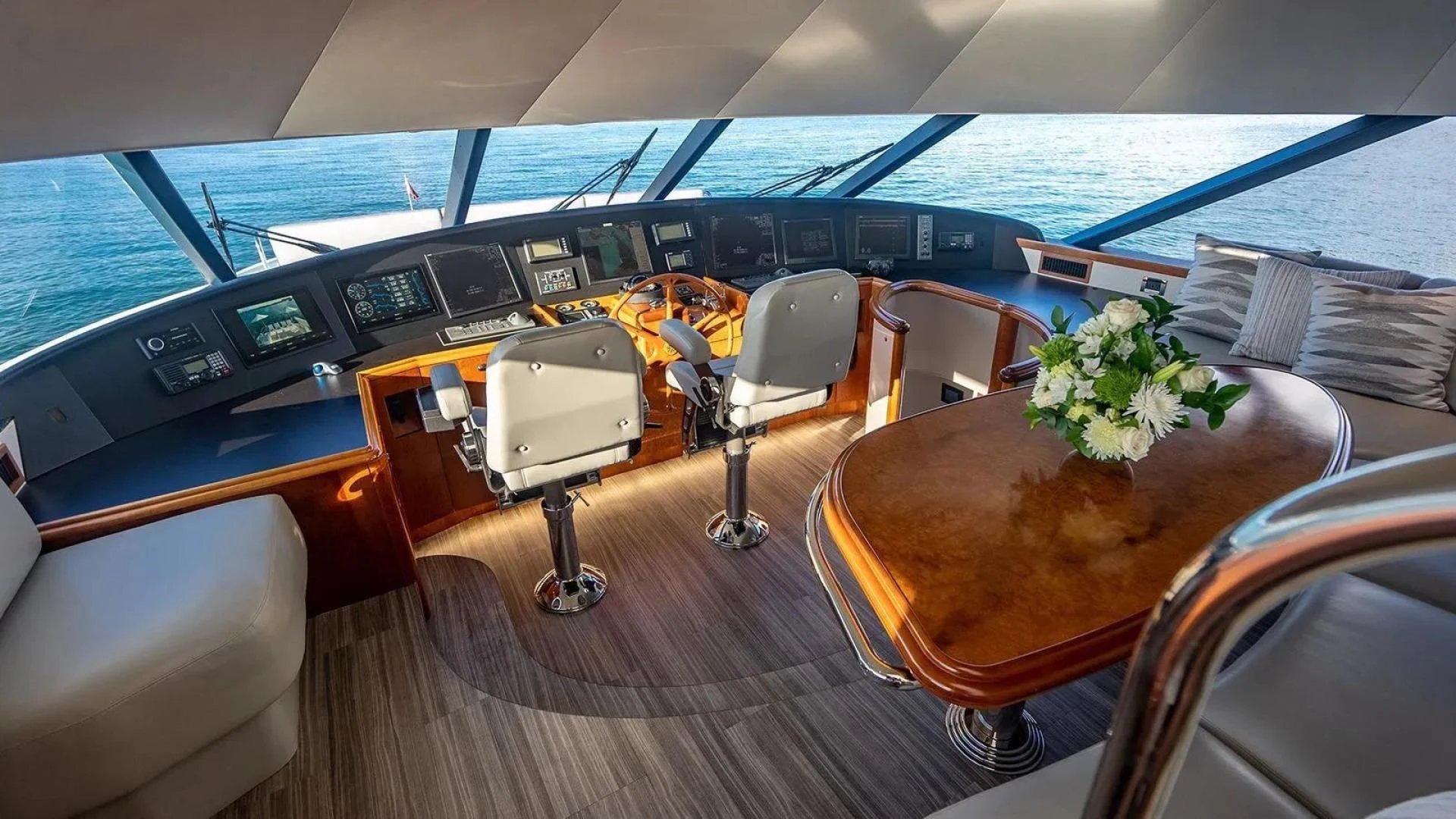 a boat with a table and chairs aboard KEMOSABE Yacht for Charter