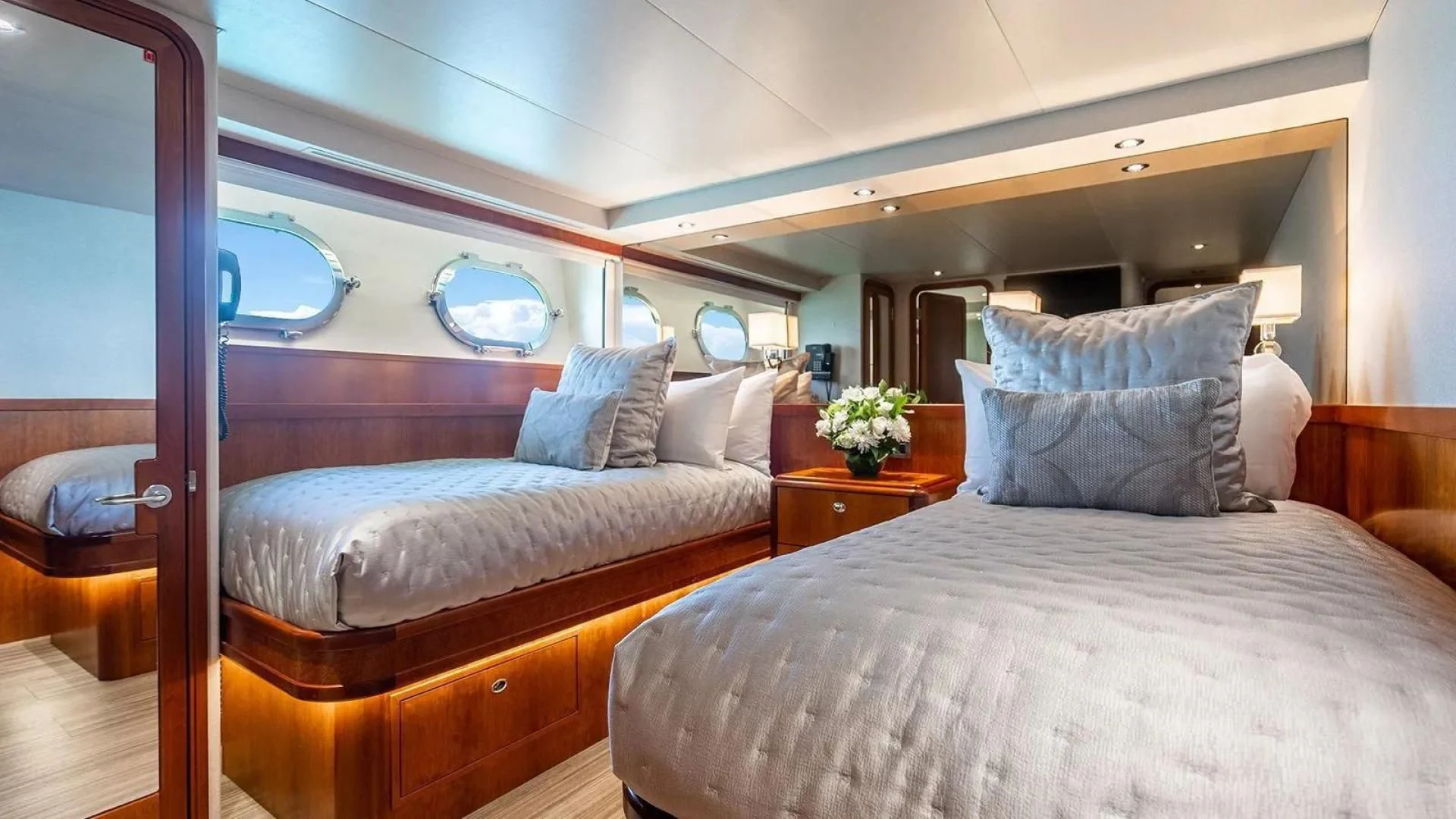 a room with a bed and a window aboard KEMOSABE Yacht for Charter